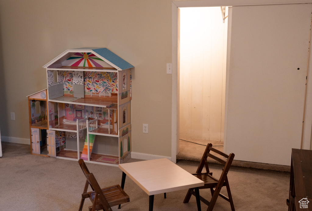 Dining space with baseboards and carpet