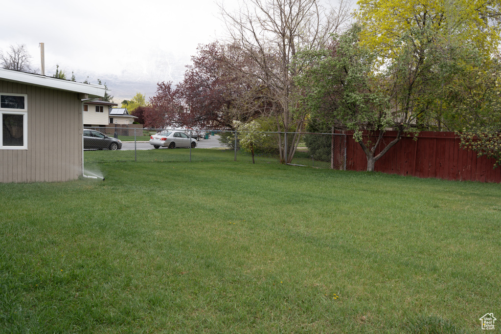 View of yard with fence
