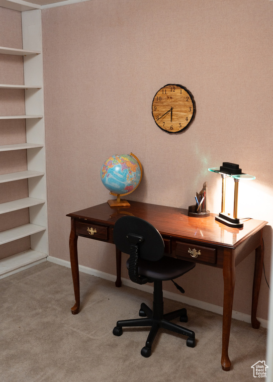 Office space featuring baseboards and carpet