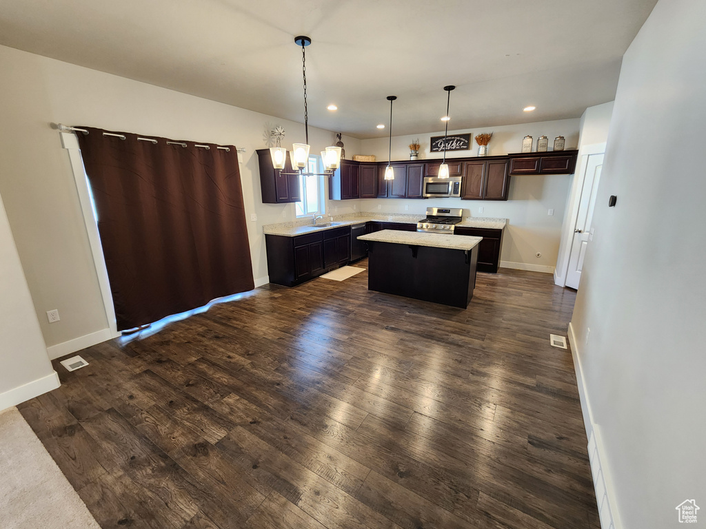 Kitchen featuring recessed lighting, light countertops, a sink, and stainless steel appliances