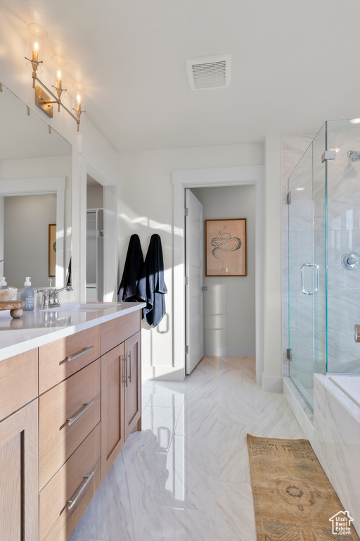 Bathroom featuring a notable chandelier, visible vents, a shower stall, and vanity