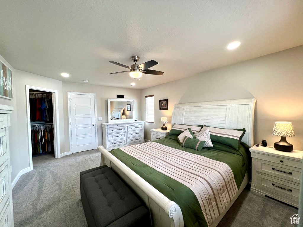 Carpeted bedroom featuring baseboards, a ceiling fan, a closet, and recessed lighting