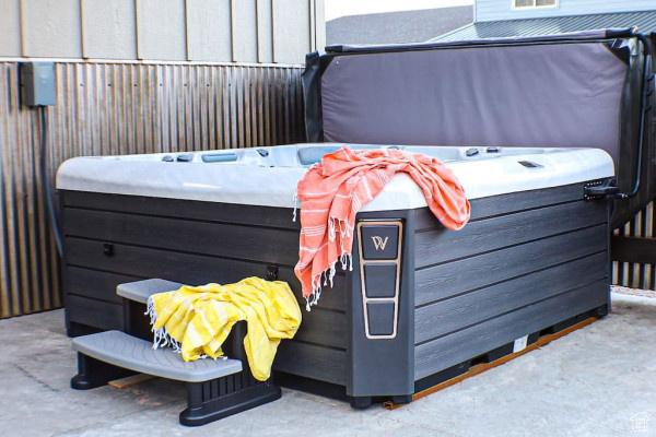 View of patio / terrace with a hot tub