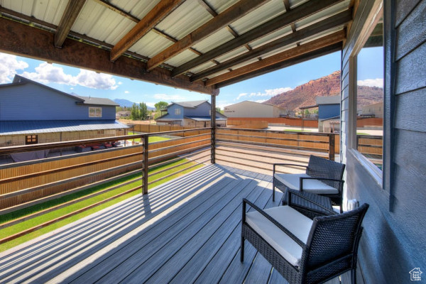 Wooden deck with a residential view