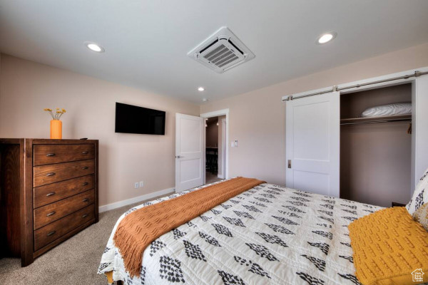 Bedroom featuring visible vents, light colored carpet, baseboards, a closet, and recessed lighting