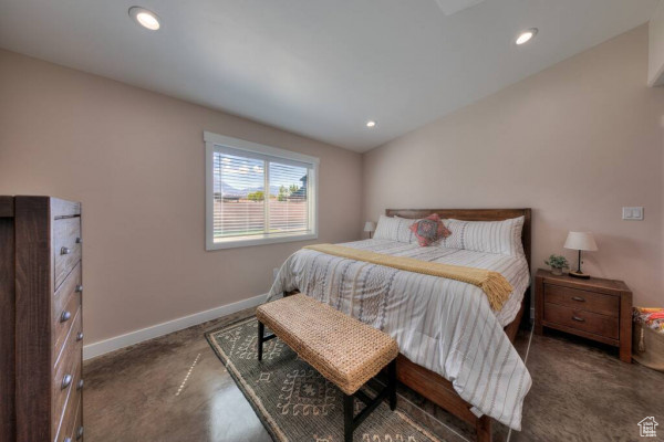 Carpeted bedroom featuring recessed lighting and baseboards