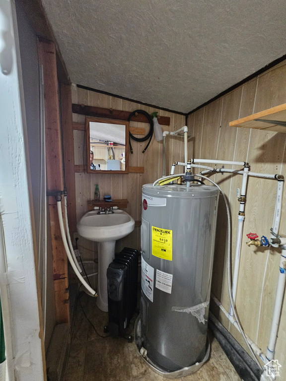 Utility room featuring water heater
