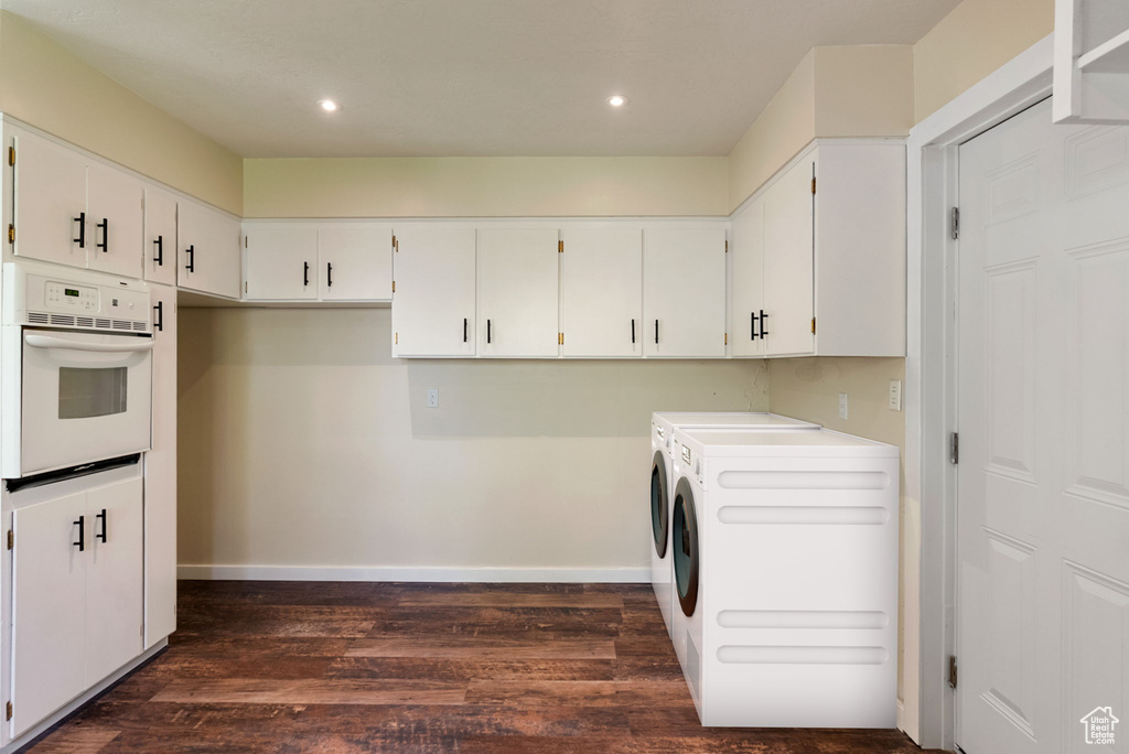 Laundry area with laundry area, dark wood finished floors, baseboards, separate washer and dryer, and recessed lighting