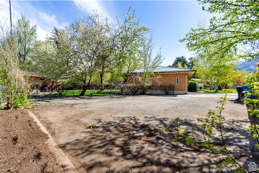 View of yard featuring fence