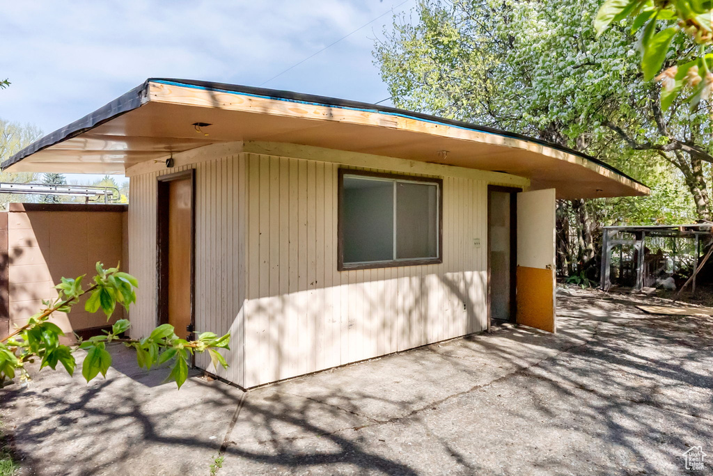 View of property exterior featuring a patio area