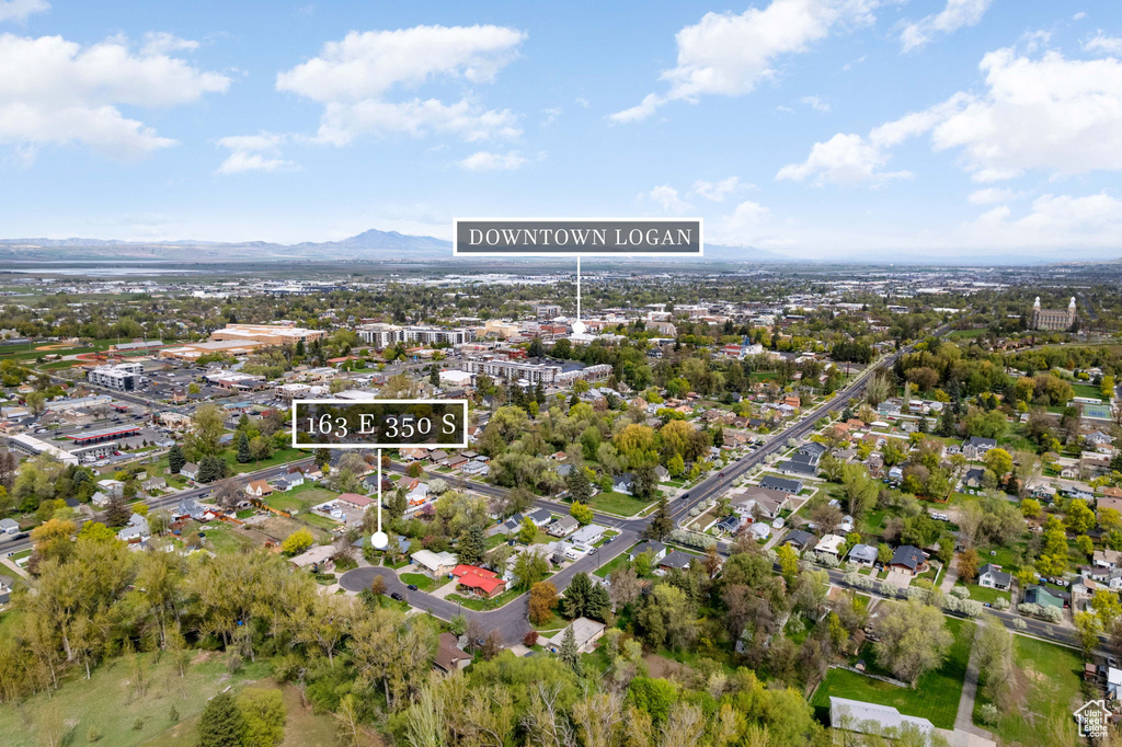 Birds eye view of property with a mountain view