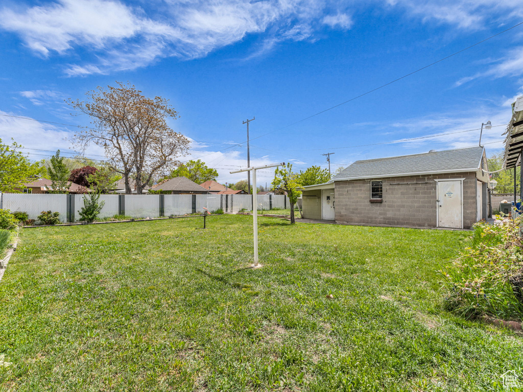 View of yard featuring fence