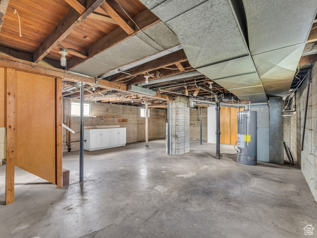Basement featuring water heater