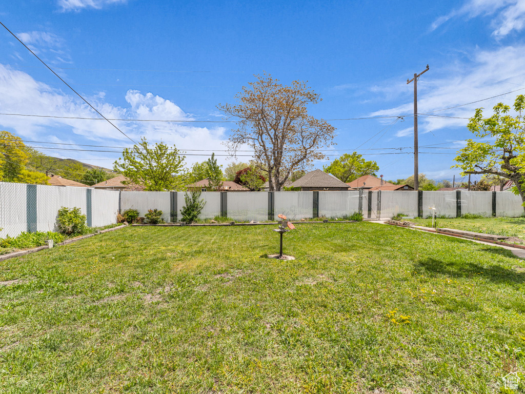 View of yard with a fenced backyard