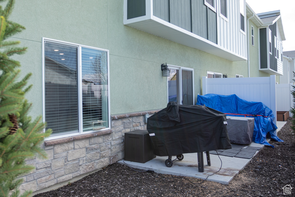 View of patio / terrace with area for grilling and fence