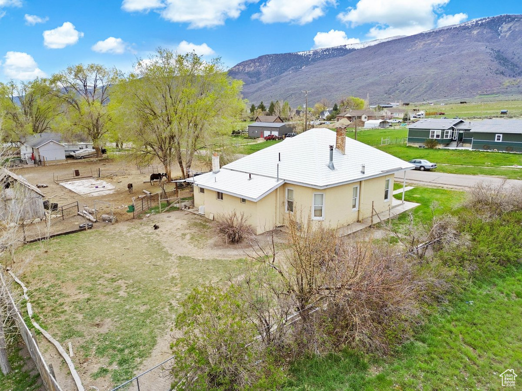 Birds eye view of property with a mountain view