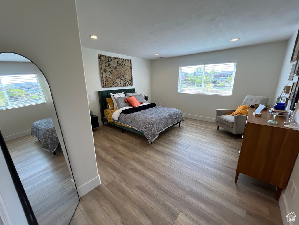 Bedroom with recessed lighting, baseboards, and light wood-type flooring