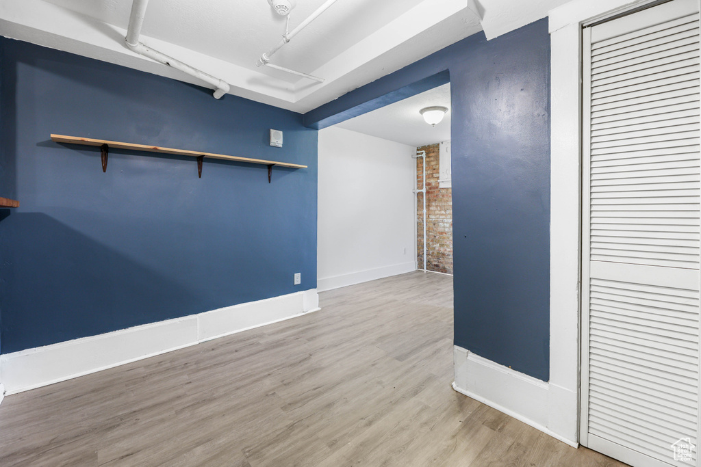 Unfurnished room featuring baseboards and wood finished floors