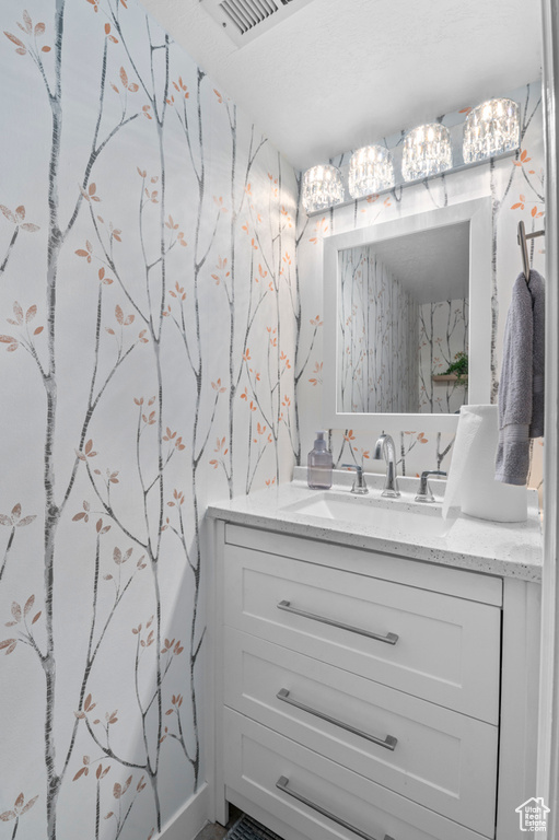 Bathroom featuring vanity and visible vents