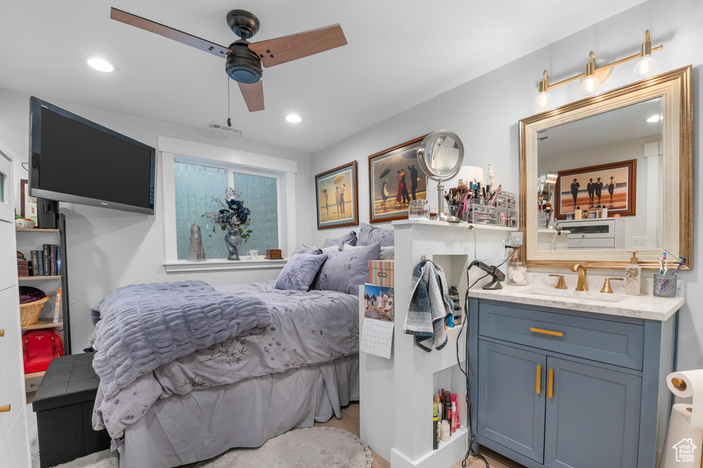 Bedroom featuring a sink, a ceiling fan, recessed lighting, and visible vents