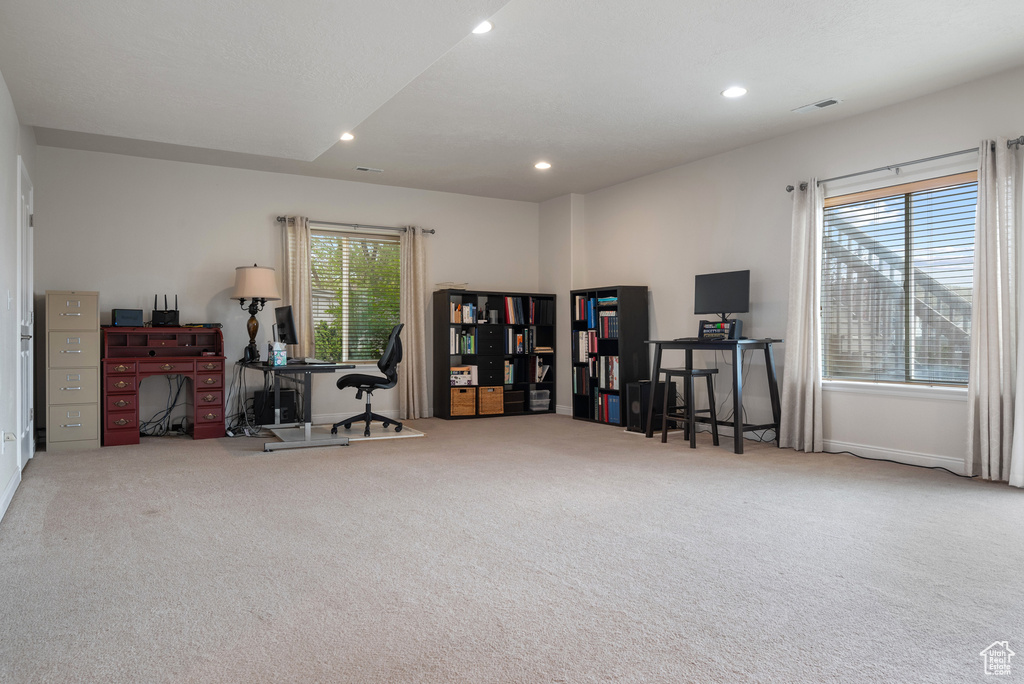 Office area featuring carpet, visible vents, recessed lighting, and baseboards