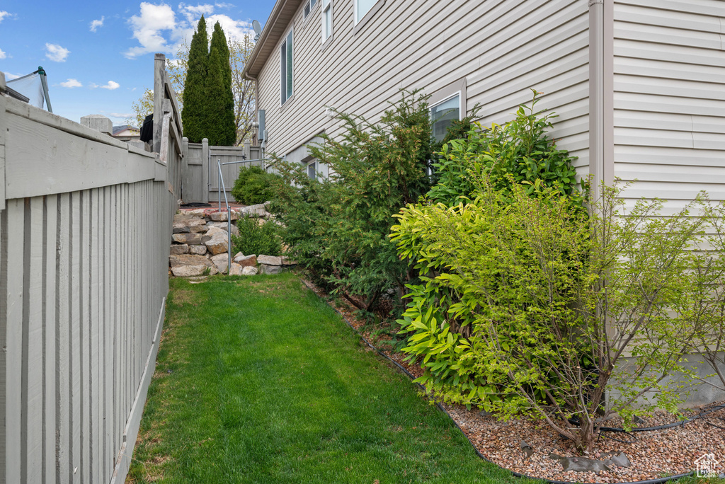 View of yard featuring fence