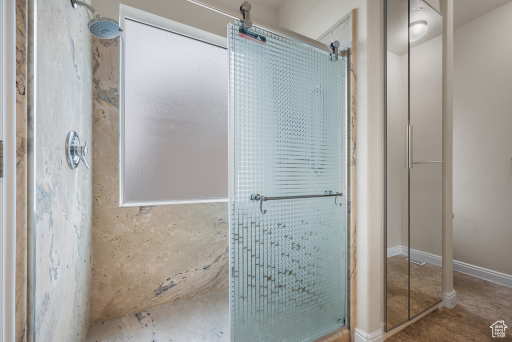 Full bathroom with a shower stall