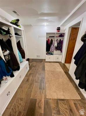 Mudroom featuring visible vents and wood finished floors