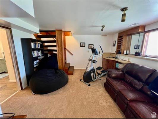Exercise room featuring carpet flooring