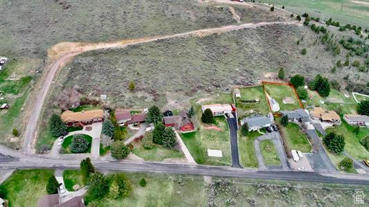 Birds eye view of property featuring a rural view