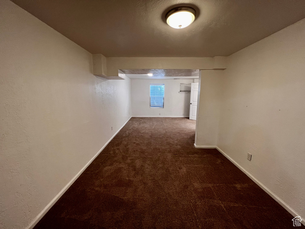 Below grade area featuring carpet floors and baseboards
