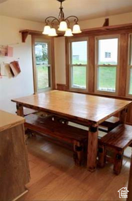 Dining space featuring a chandelier and light wood finished floors