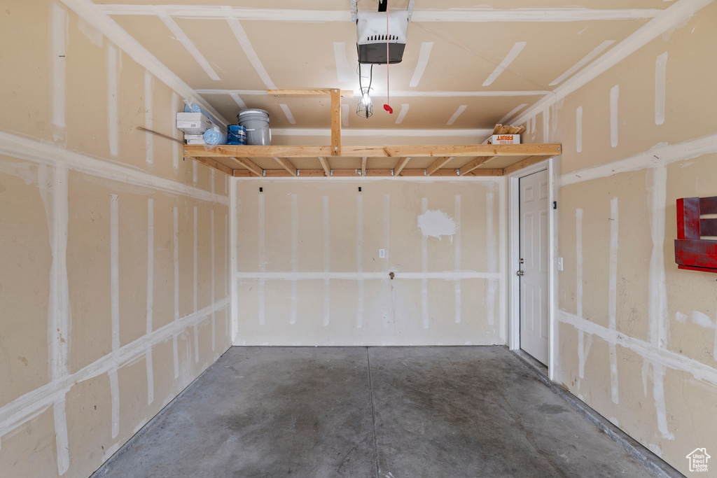Garage featuring a garage door opener