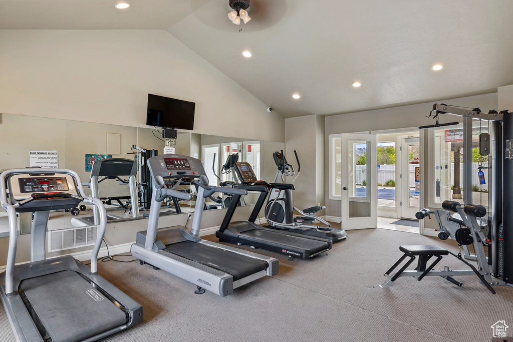 Exercise room featuring recessed lighting, baseboards, french doors, and high vaulted ceiling