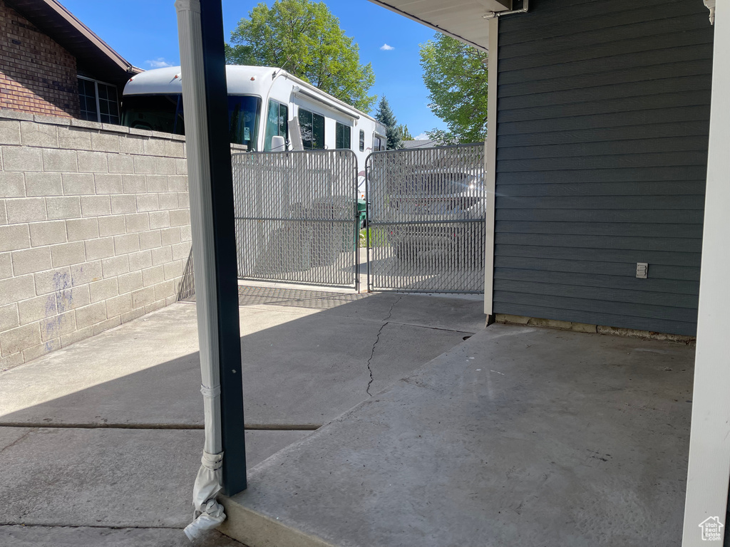 View of patio / terrace featuring fence and a gate
