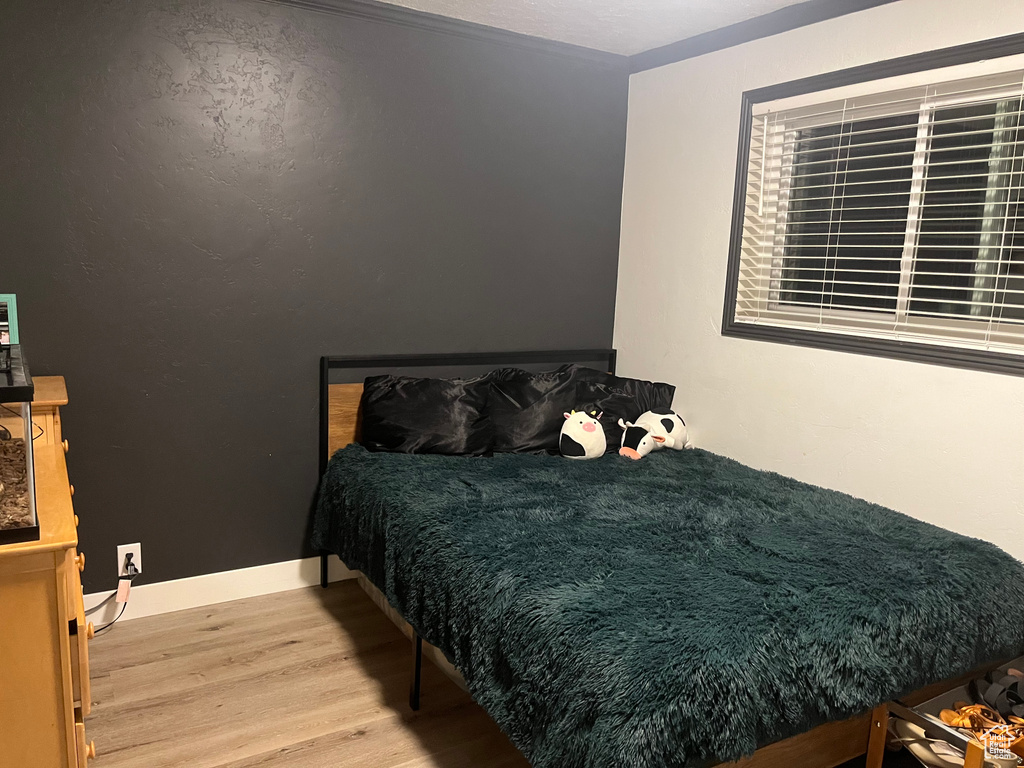 Bedroom featuring wood finished floors