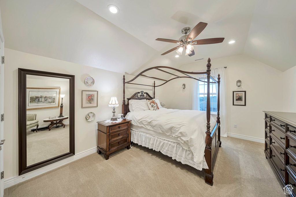 Bedroom with light colored carpet, ceiling fan, baseboards, recessed lighting, and vaulted ceiling