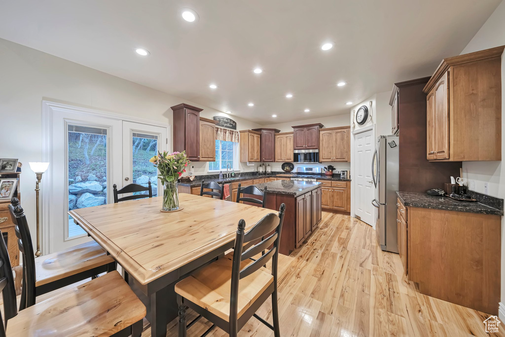 Kitchen featuring recessed lighting, a sink, light wood-style floors, a center island, and appliances with stainless steel finishes