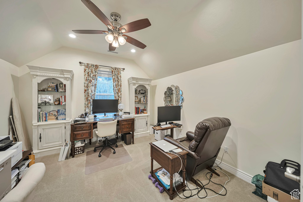 Home office with light colored carpet, ceiling fan, lofted ceiling, and recessed lighting