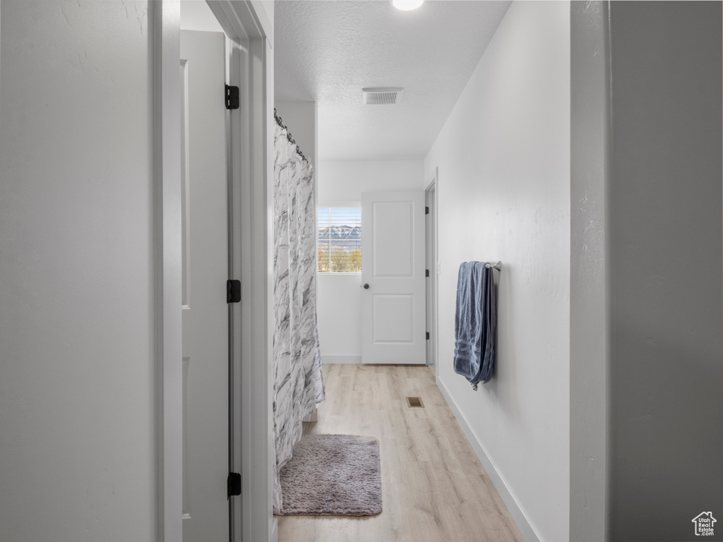 Bathroom with wood finished floors and visible vents
