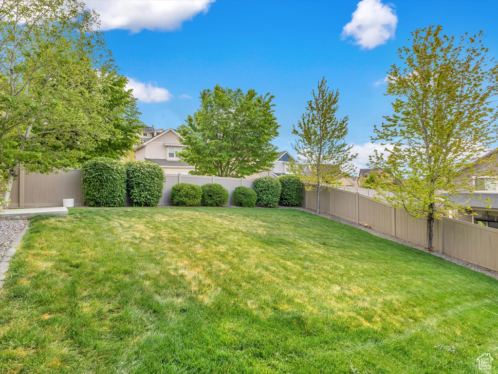 View of yard featuring a fenced backyard