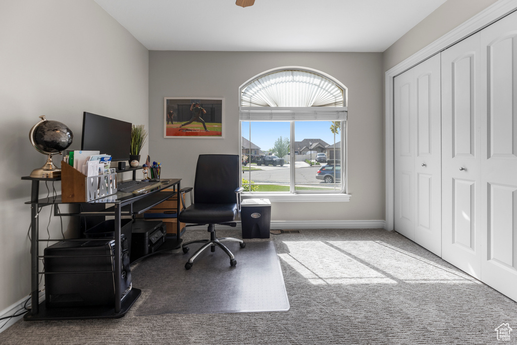 Carpeted office with baseboards