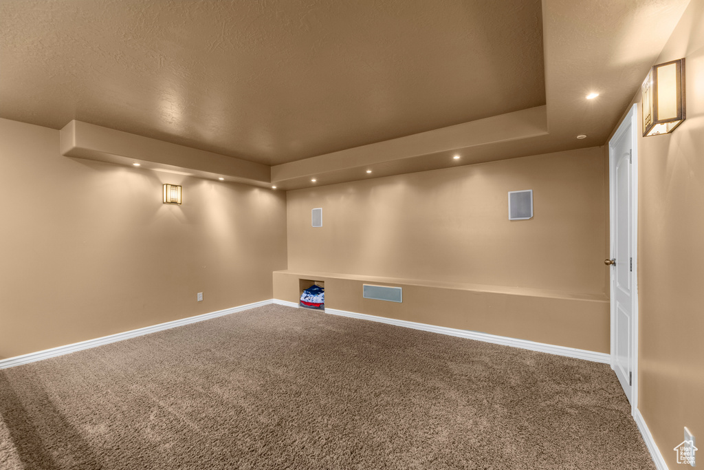 Interior space with carpet flooring, recessed lighting, baseboards, and visible vents