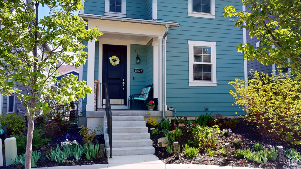View of exterior entry featuring a porch
