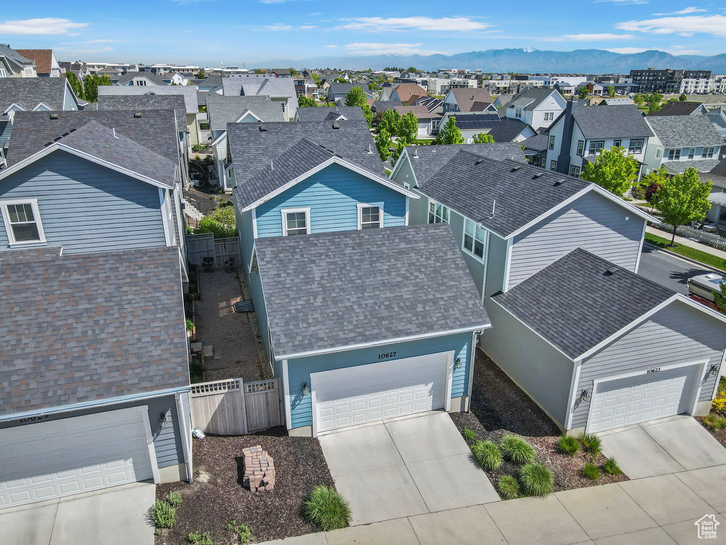 Aerial view of residential area with a mountainous background