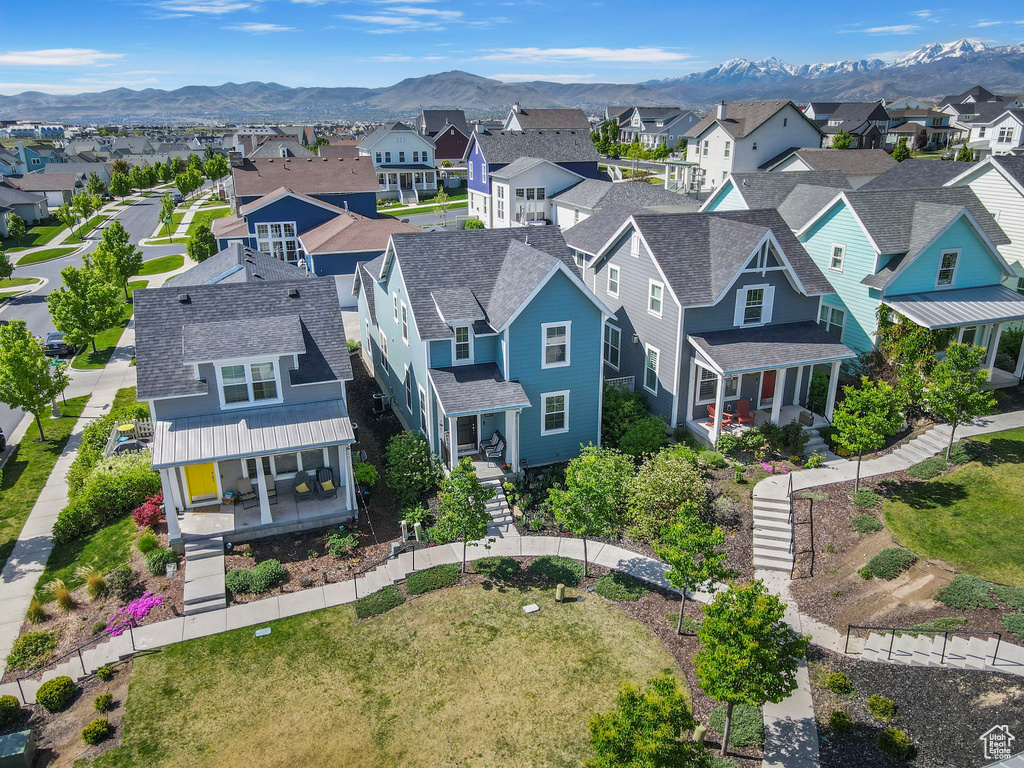 Aerial view of residential area featuring mountains