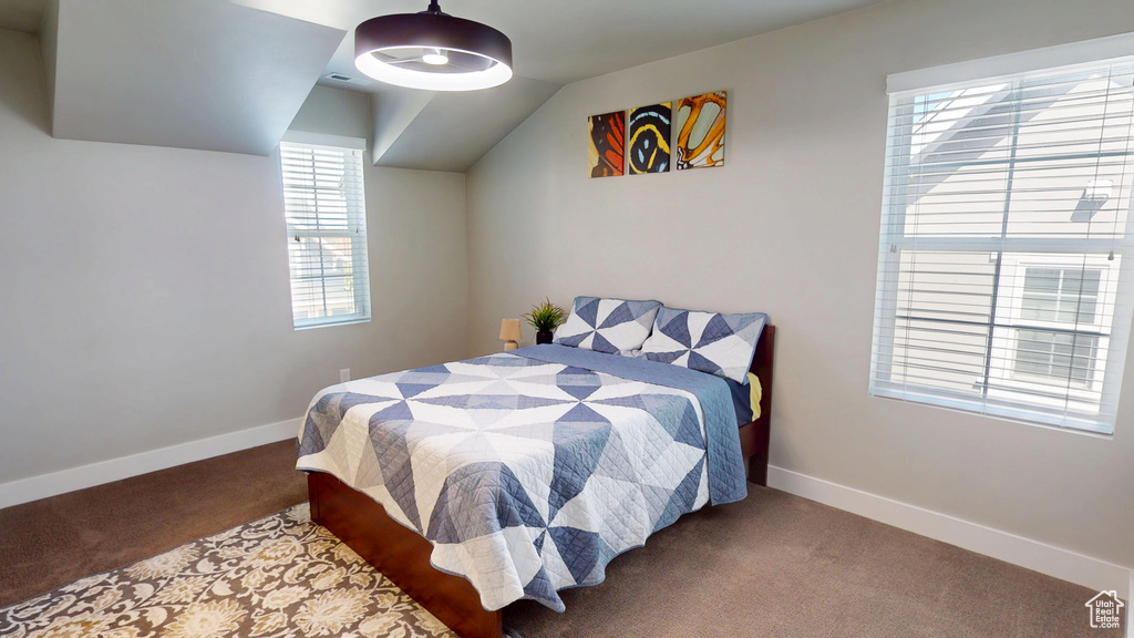 Carpeted bedroom with baseboards