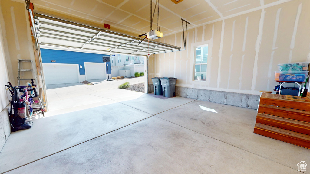 Garage featuring a garage door opener