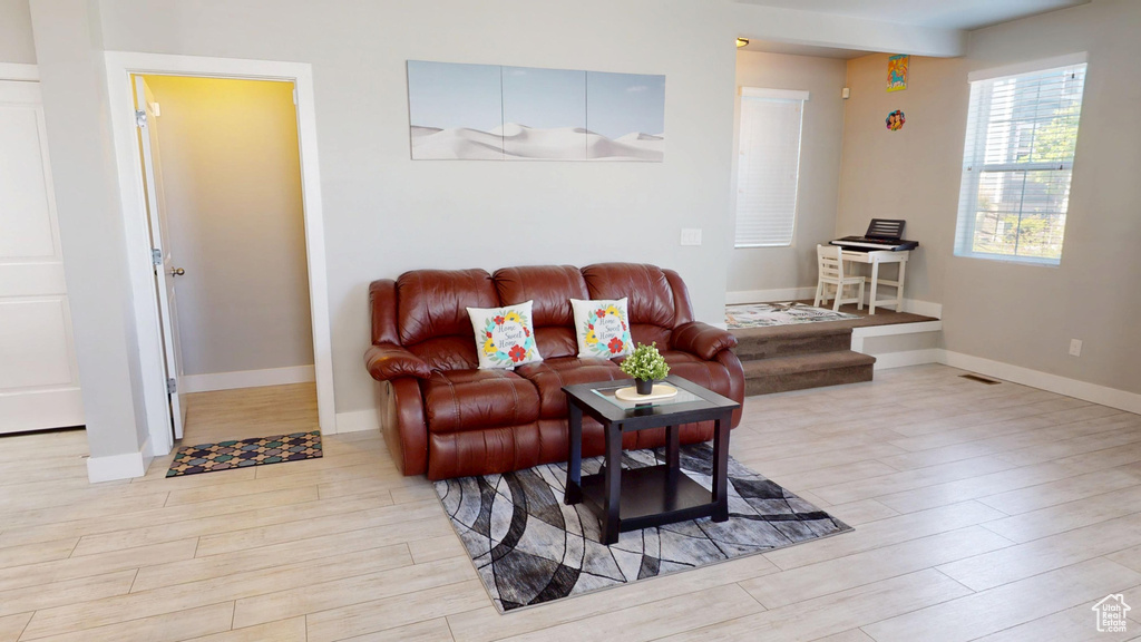 Living room featuring baseboards and wood finished floors