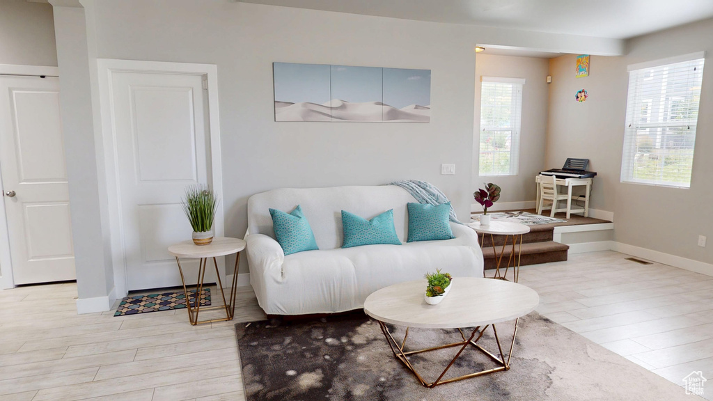 Living area featuring wood finished floors and baseboards